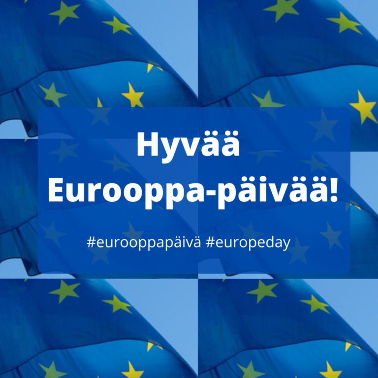 Eurooppa-päivän toivotus taustalla EU-lippuja